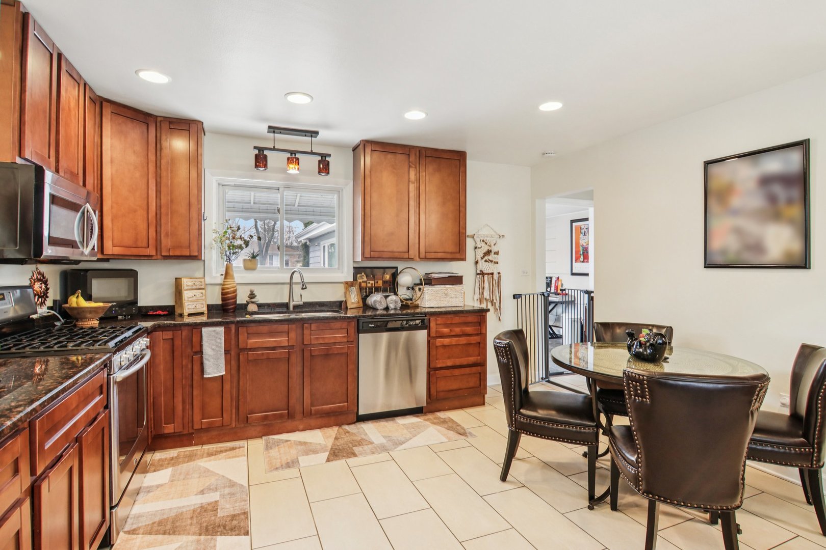 238 West Frontage Road Northfield, IL 60093 - Photo 4 of 16 a kitchen with stainless steel appliances granite countertop a stove top oven a sink dishwasher and a refrigerator