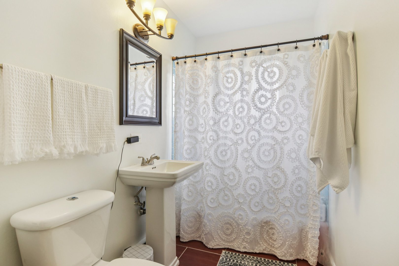 238 West Frontage Road Northfield, IL 60093 - Photo 9 of 16 a bathroom with a sink a toilet and a mirror