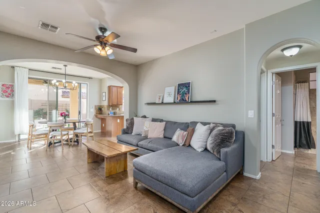 a living room with furniture and a large window
