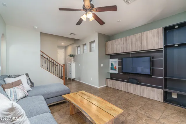 a view of a dining room with furniture a chandelier and wooden floor