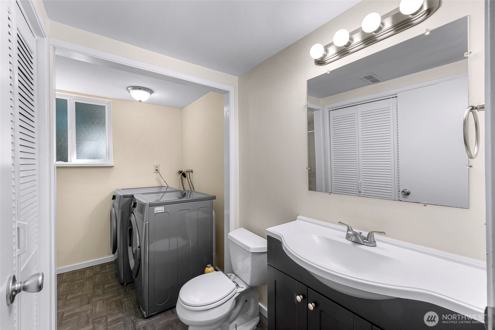 21313 2nd Drive Southeast Bothell, WA 98021 - Photo 19 of 30 a bathroom with a sink vanity mirror and toilet