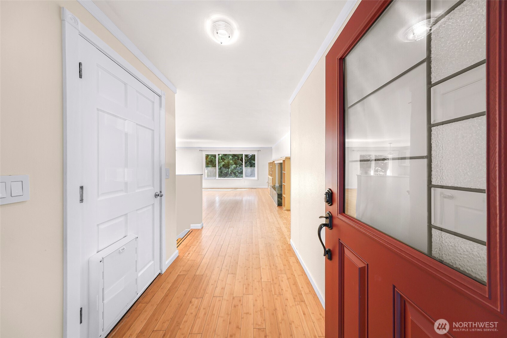 21313 2nd Drive Southeast Bothell, WA 98021 - Photo 3 of 30 a view of a hallway with wooden floor and staircase
