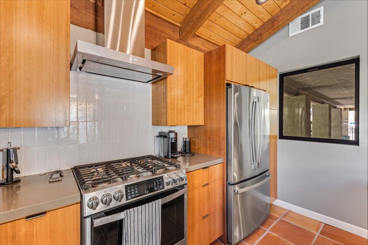 2727 Thomas Road Hollister, CA 95023 - Photo 50 of 83 a kitchen with stainless steel appliances granite countertop a refrigerator and a stove