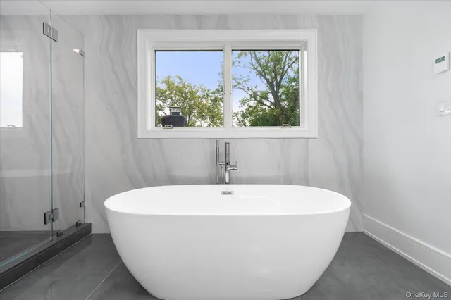 a white tub sitting in a bathroom
