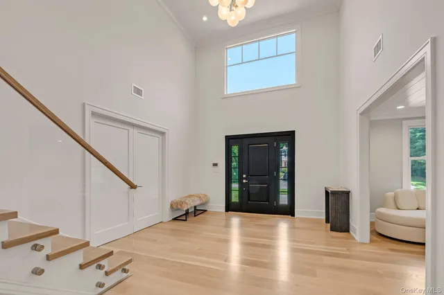 a view of a bedroom with furniture and staircase