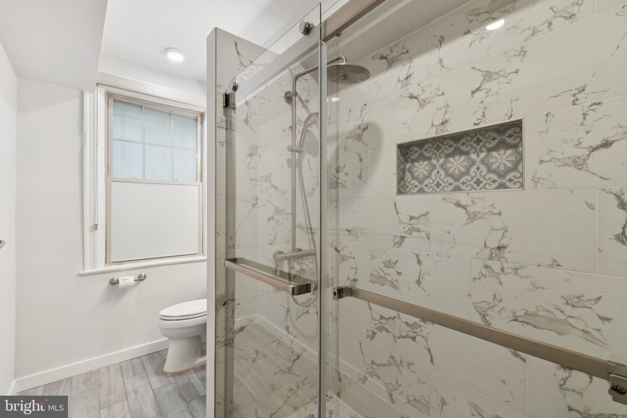1858 California Street Northwest, Unit 5 Washington, DC 20009 - Photo 20 of 26 Modern shower with elegant tiles.