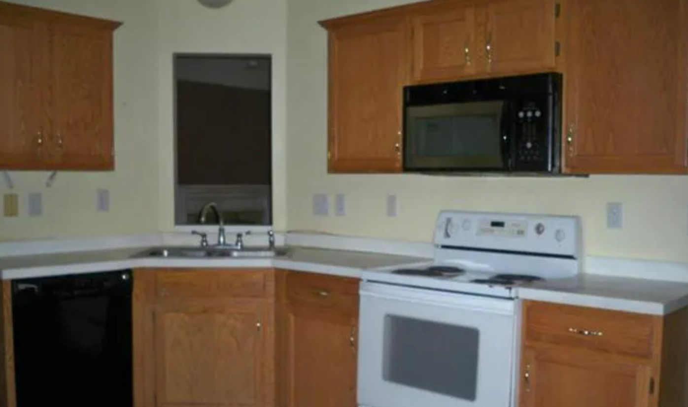 1714 Dublin Court Spring Hill, TN 37174 - Photo 3 of 3 a kitchen with a sink and a microwave