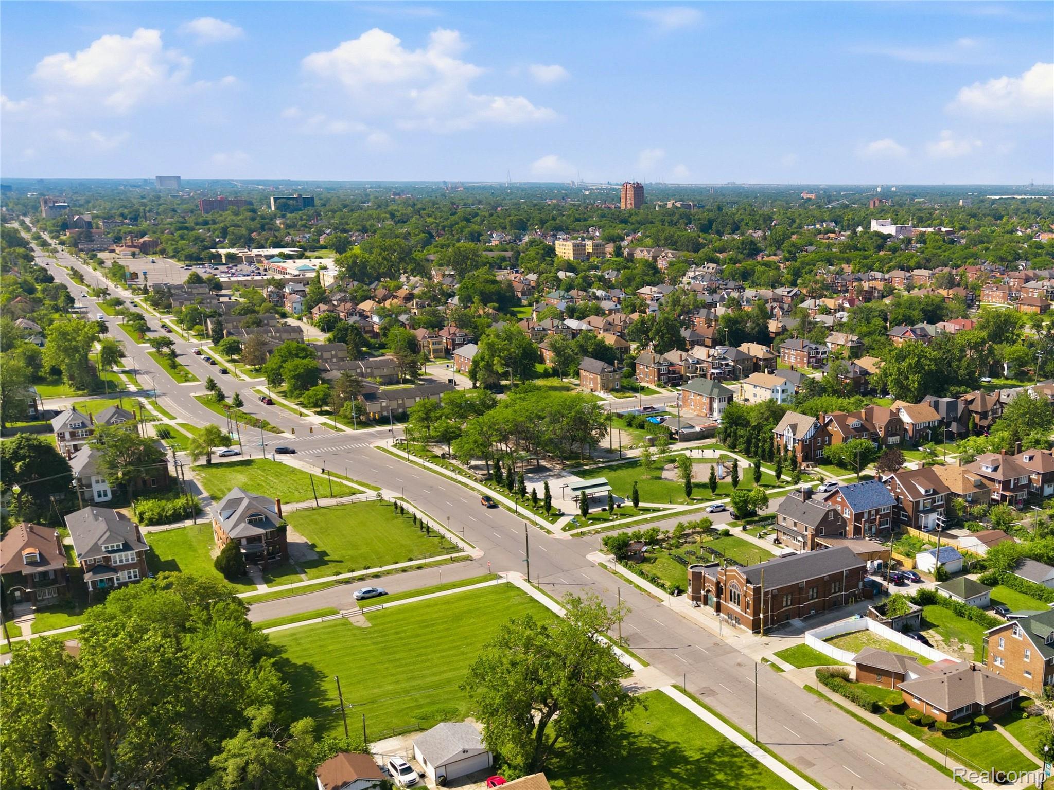 1945 Atkinson Street Detroit, MI 48206 - Photo 44 of 49 Aerial depiction of a residential area with extensive tree coverage and multiple roadways