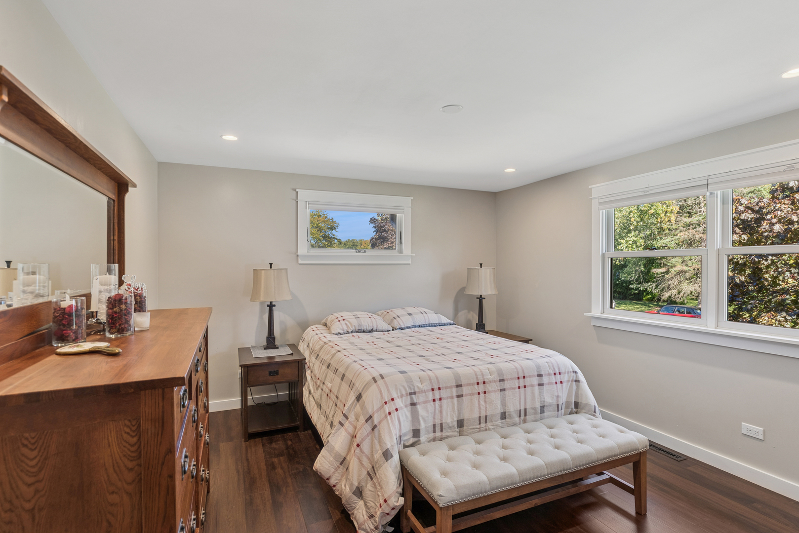 422 Northgate Road Lindenhurst, IL 60046 - Photo 9 of 24 a bedroom with a bed a table and a dresser