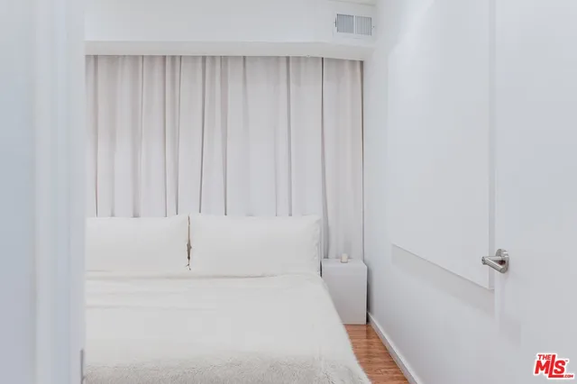 a bathroom with a toilet a sink and a mirror