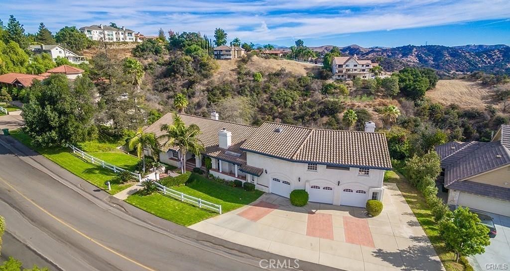 2684 Shady Ridge Lane Diamond Bar, CA 91765 - Photo 1 of 1 an aerial view of a house with a garden and trees