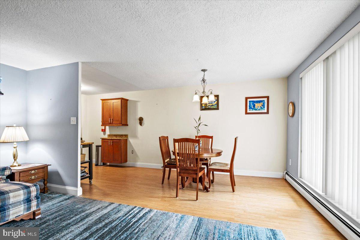 201 Cuthbert Boulevard, Unit D50 Haddon Township, NJ 08107 - Photo 6 of 46 Living Room View to Dining Room