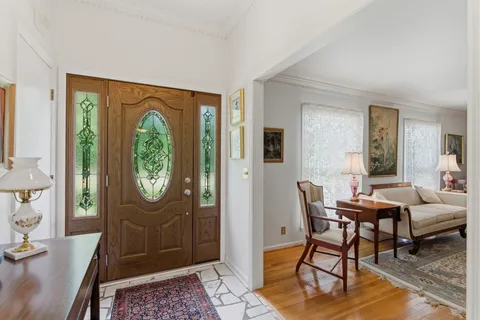 a view of a livingroom with furniture and a window