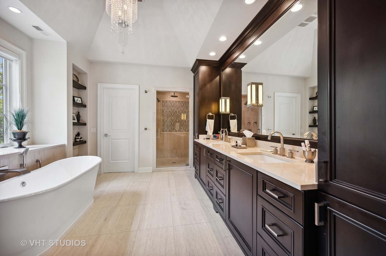 555 Sheridan Road Glencoe, IL 60022 - Photo 17 of 27 a large white bathroom with a double vanity sink a mirror and a bathtub
