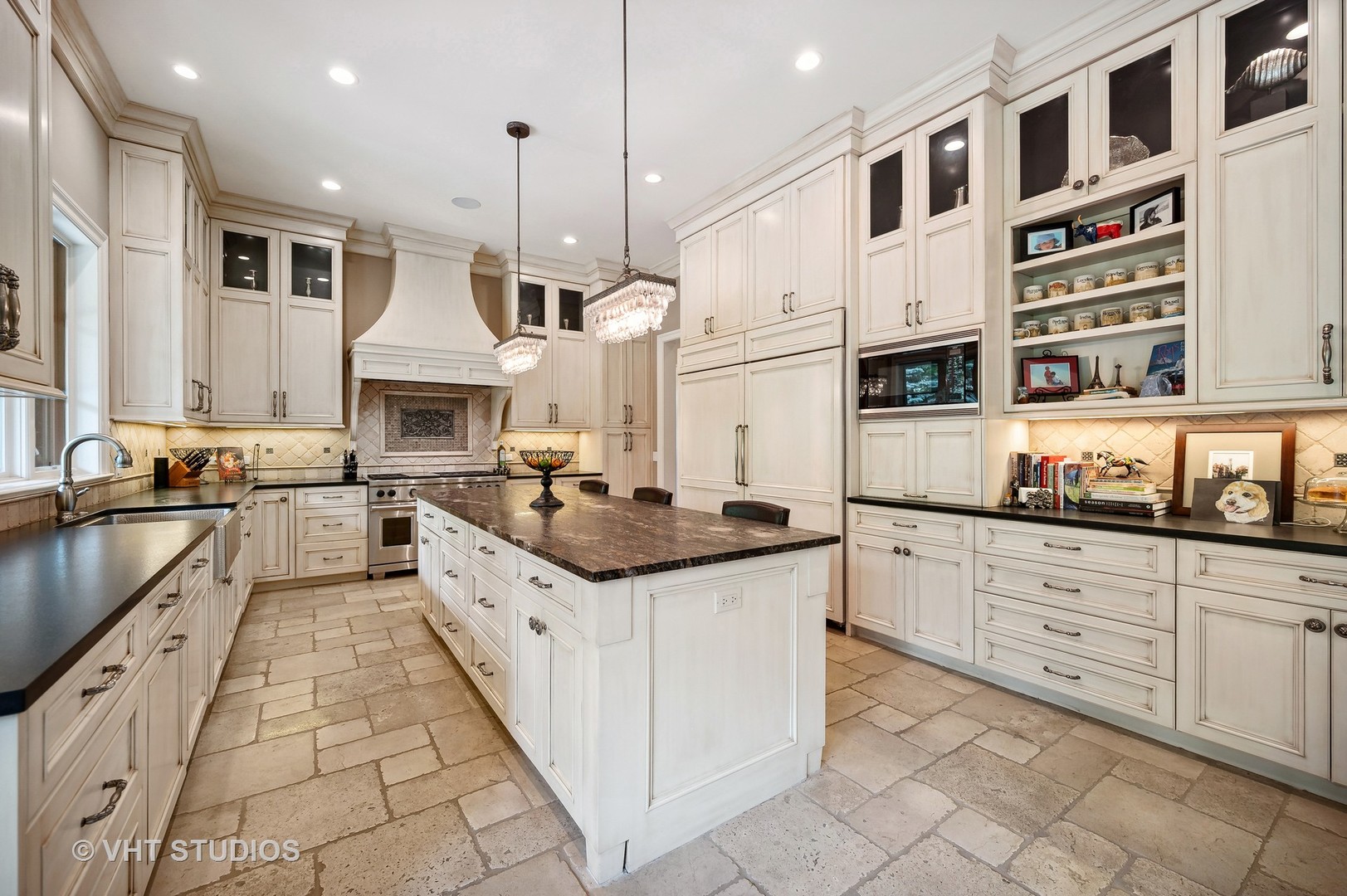 555 Sheridan Road Glencoe, IL 60022 - Photo 10 of 27 a large kitchen with stainless steel appliances granite countertop a stove and a sink