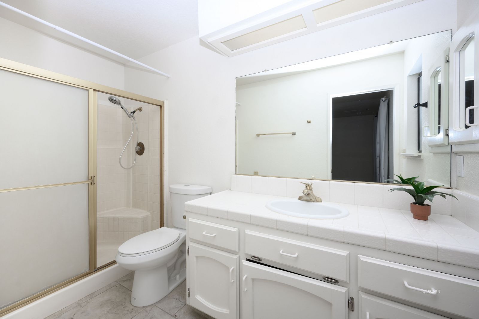 704 Beth Lane Ridgecrest, CA 93555 - Photo 33 of 39 a bathroom with a sink a toilet and shower