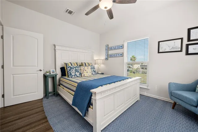 a bedroom with a bed couch and window