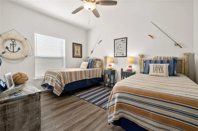 a bedroom with bed and a chandelier