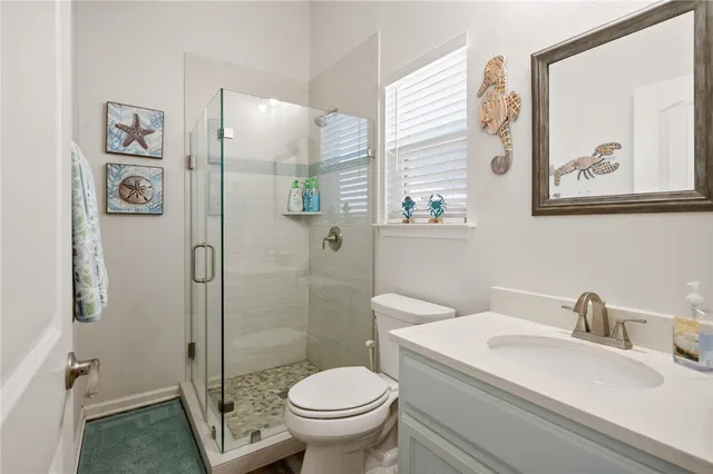 a bathroom with a toilet sink and shower