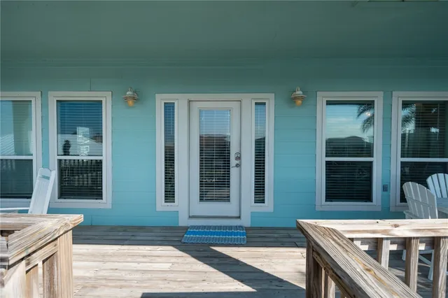 a view of an outdoor space kitchen and windows
