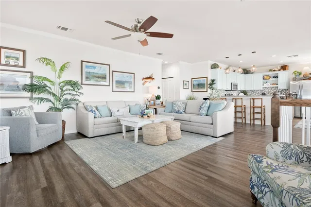 a living room with furniture and white walls