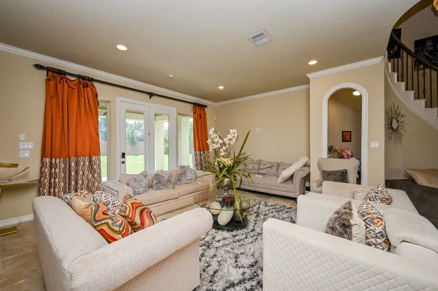 a living room with furniture and a large window
