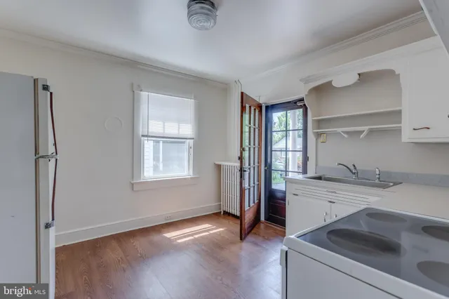 a view of a hallway view with wooden floor and staircase