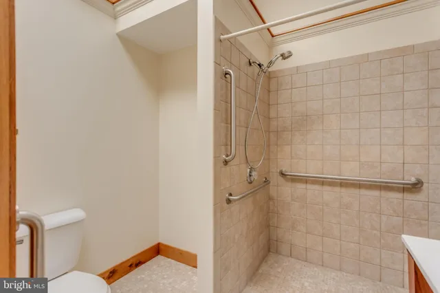 a kitchen with stainless steel appliances a refrigerator sink and wooden floor