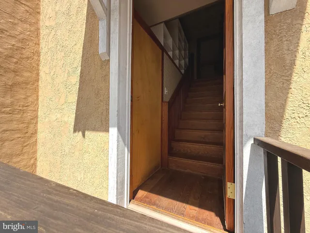 a view of an empty room with glass door