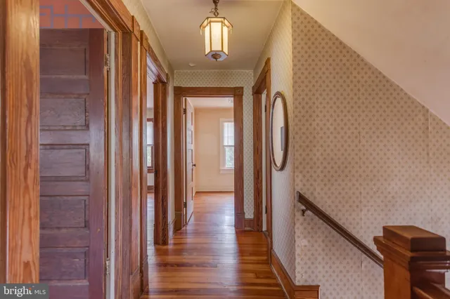 a bathroom with a sink a toilet a mirror and shower