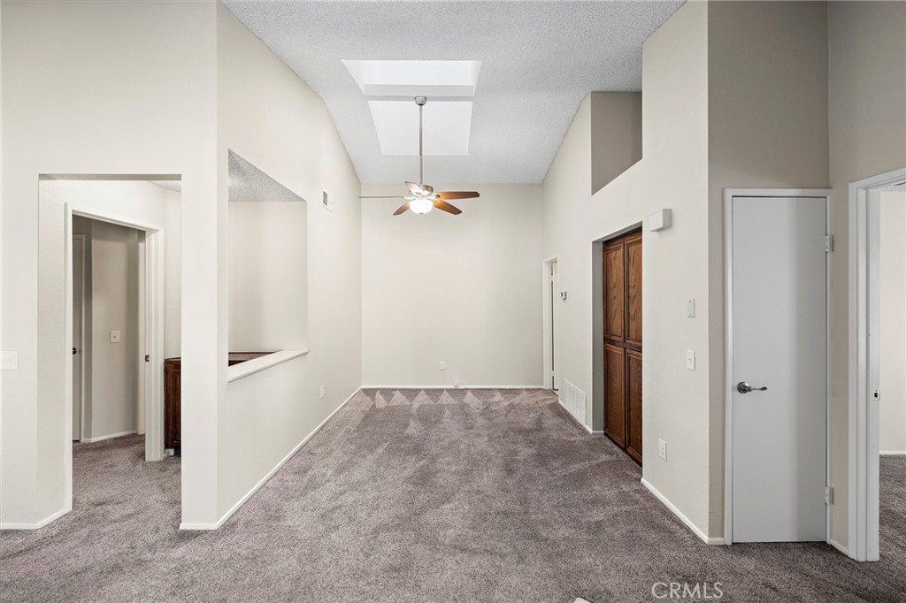 5050 Canyon Crest Drive, Unit 7 Riverside, CA 92507 - Photo 11 of 44 family room with skylight