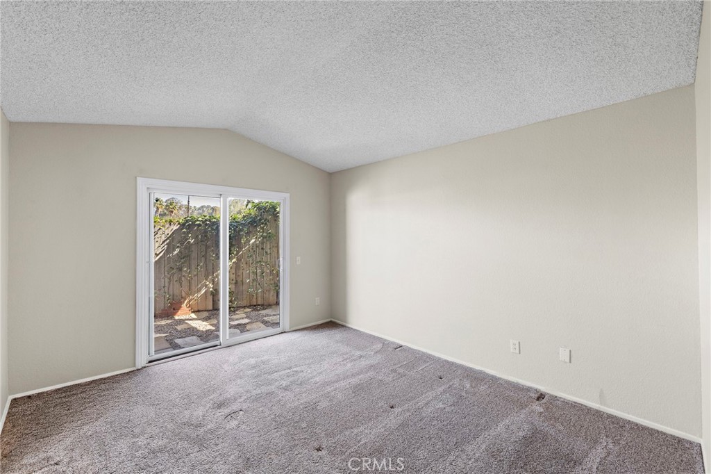5050 Canyon Crest Drive, Unit 7 Riverside, CA 92507 - Photo 20 of 44 Primary Bedroom with backyard access