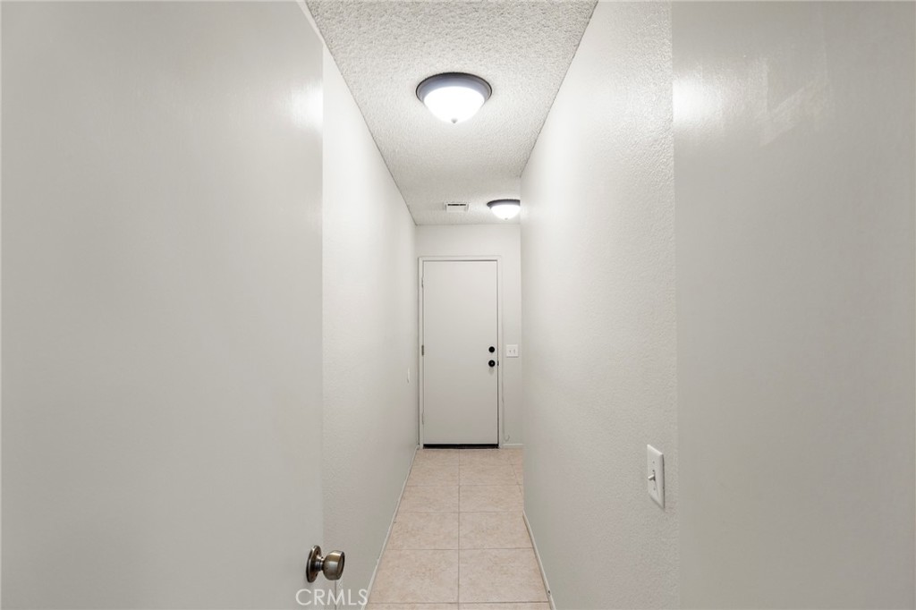 5050 Canyon Crest Drive, Unit 7 Riverside, CA 92507 - Photo 28 of 44 Garage hallway