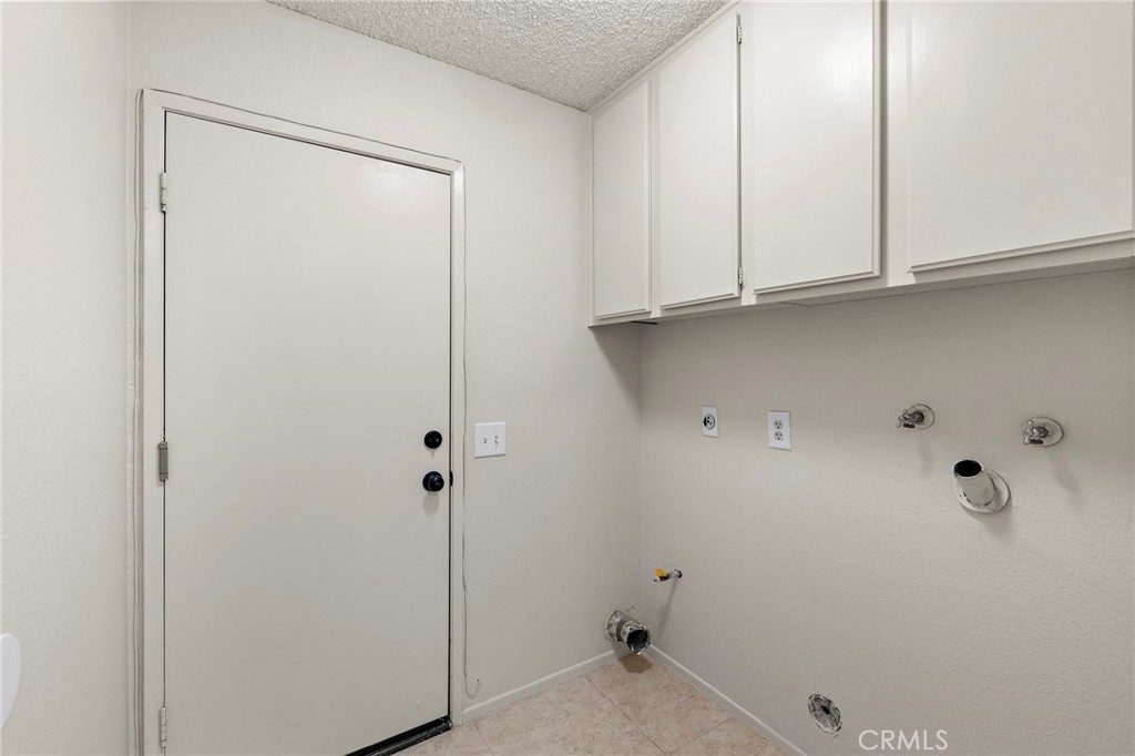 5050 Canyon Crest Drive, Unit 7 Riverside, CA 92507 - Photo 29 of 44 garage hallway with washer/dryer hookups