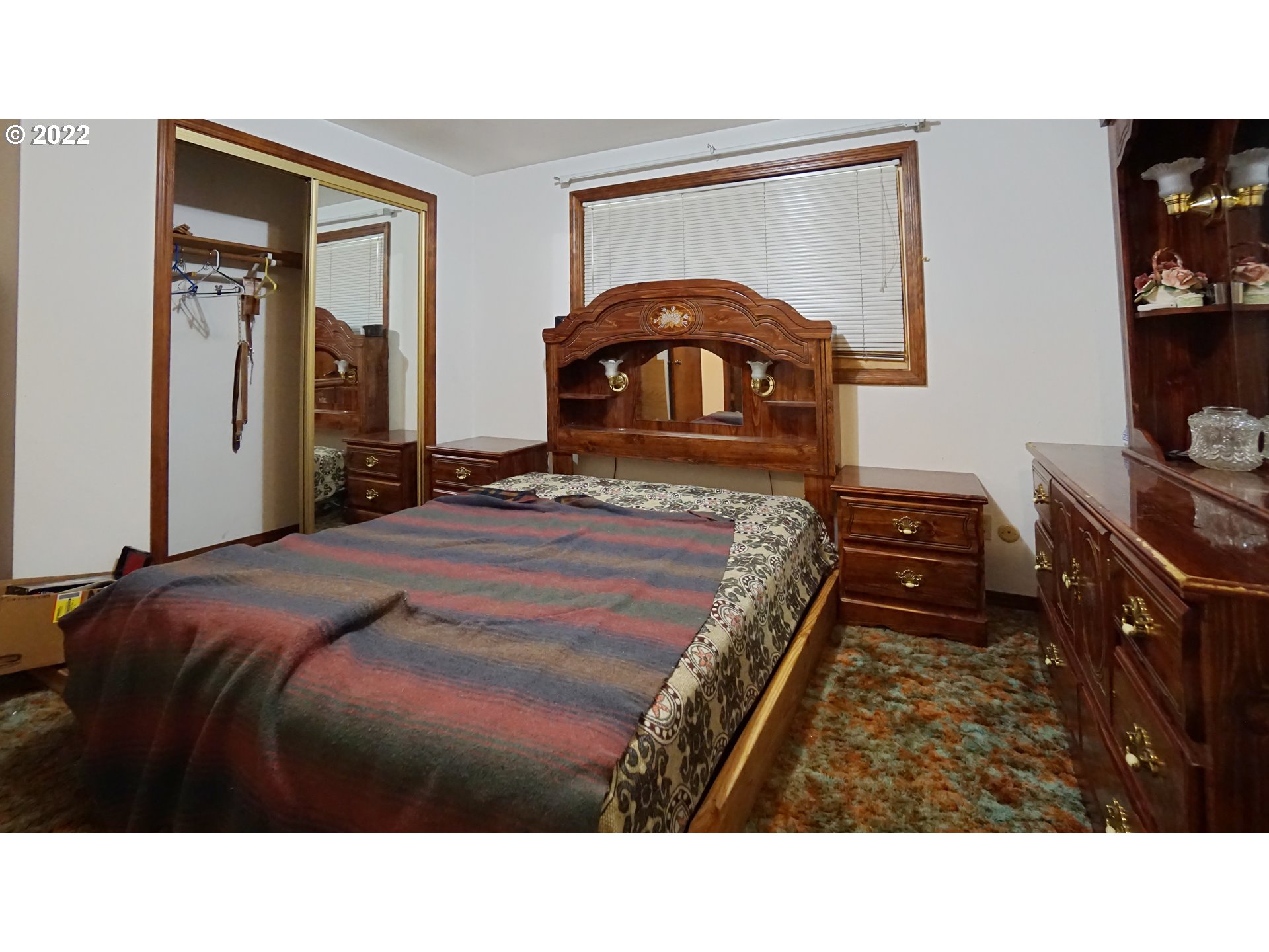 13054 Dominic Road Northeast Mount Angel, OR 97362 - Photo 23 of 32 a bedroom with a bed and a closet