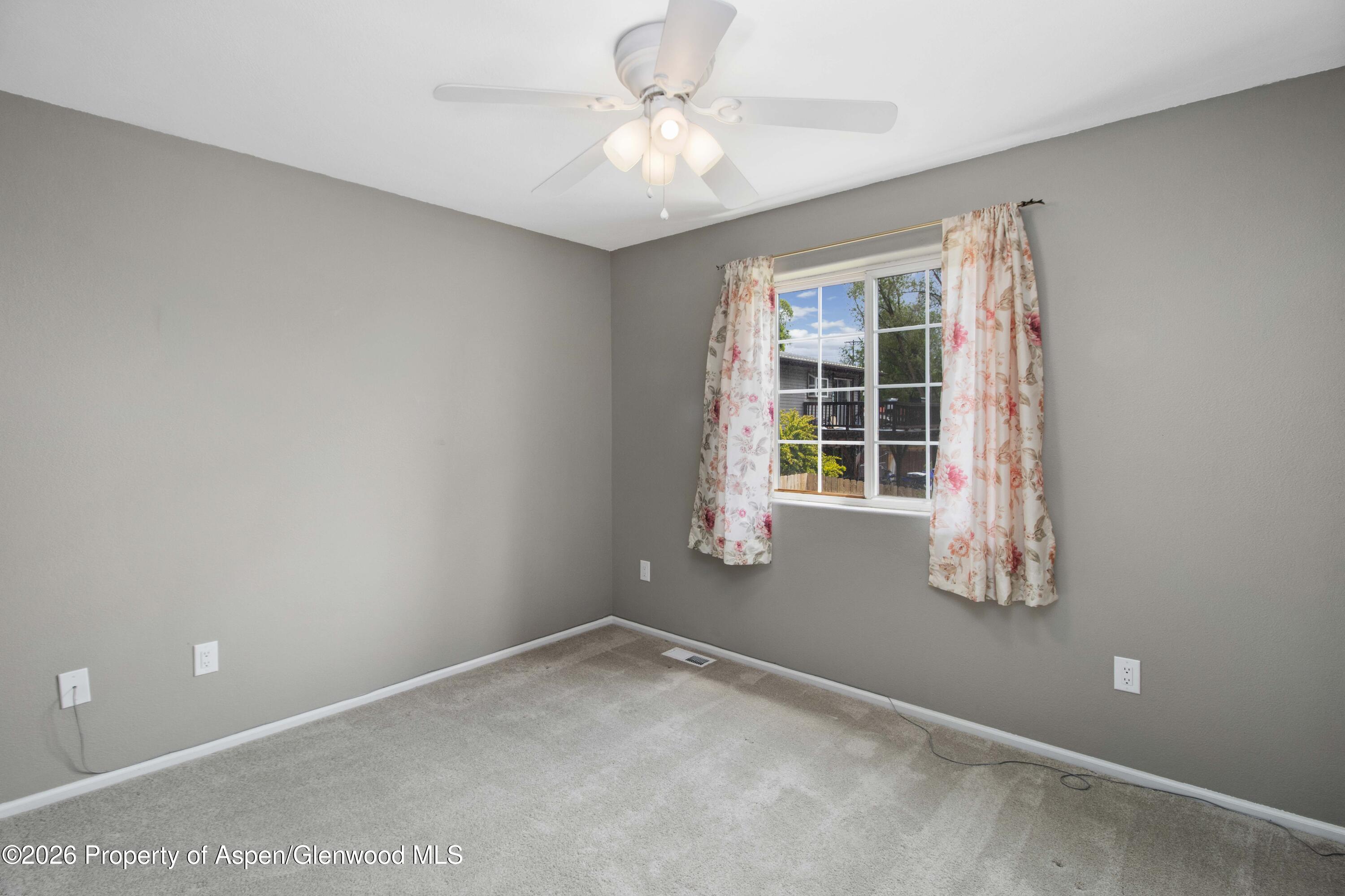 660 Aspen Avenue Rifle, CO 81650 - Photo 11 of 30 a view of an empty room with a window