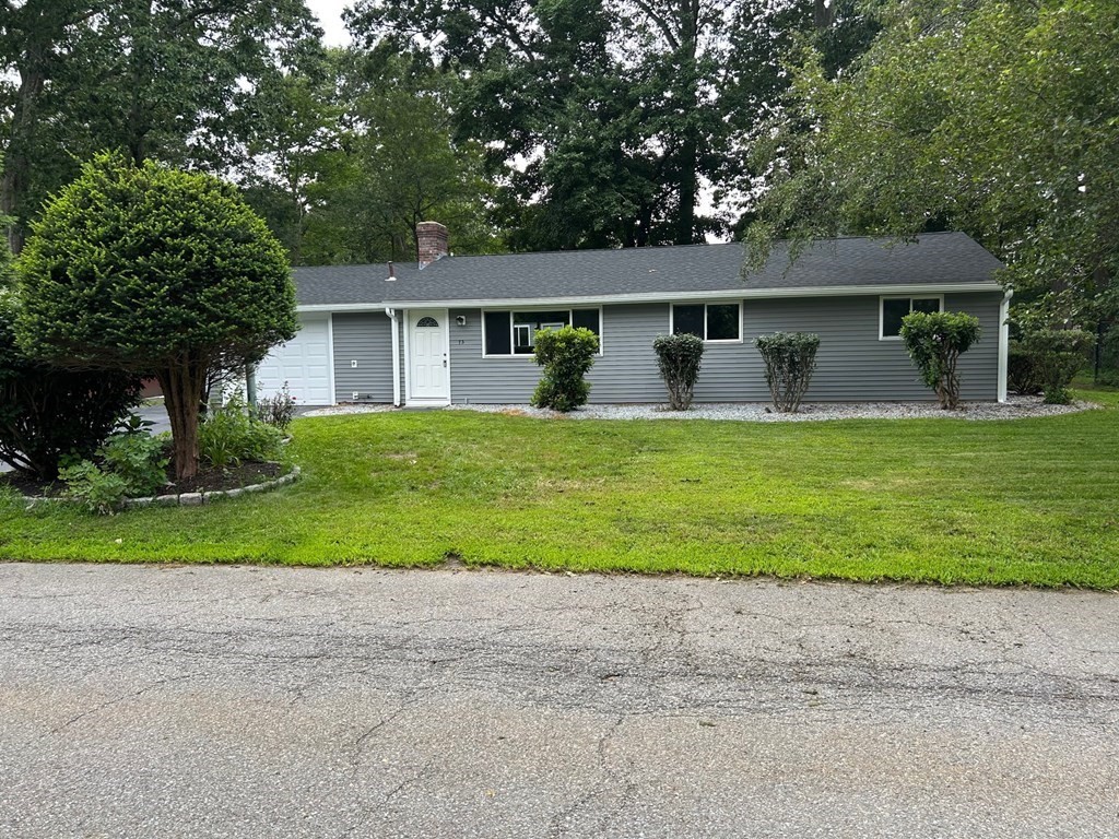 front view of a house with a yard