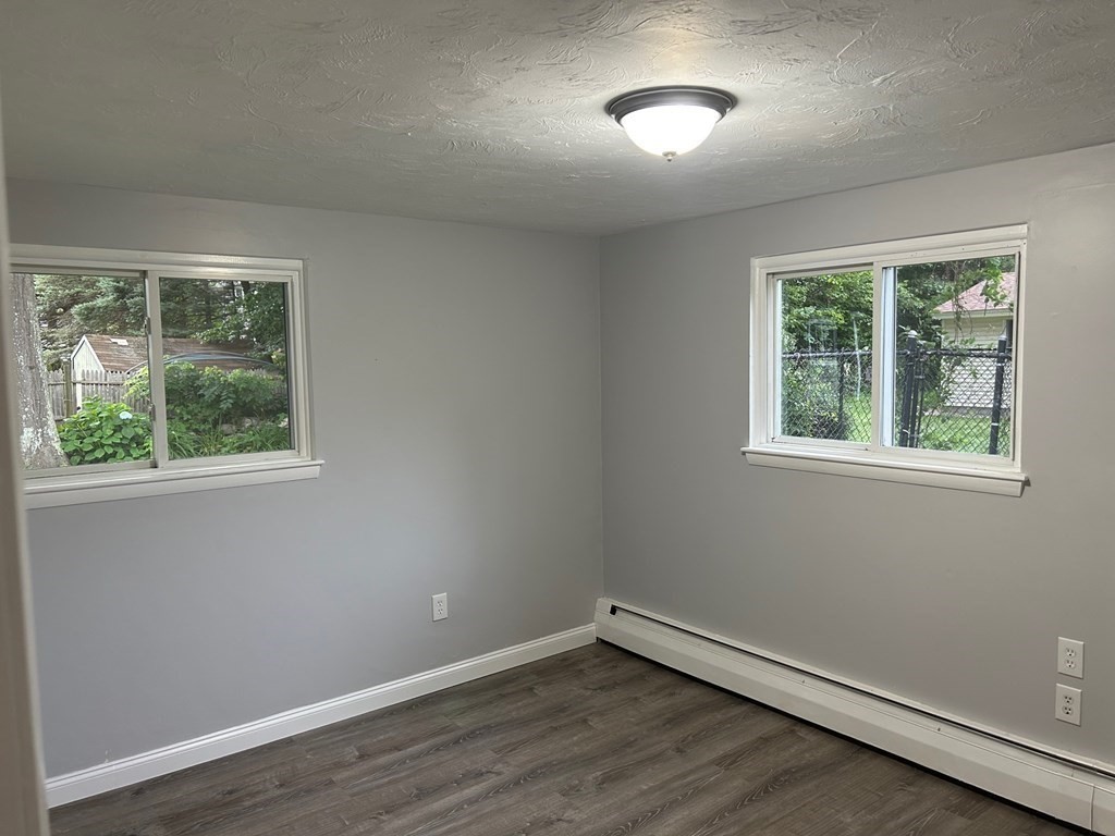 73 Brooks Street Maynard, MA 01754 - Photo 12 of 17 an empty room with a window