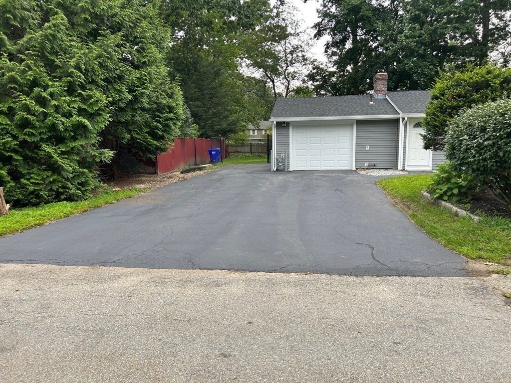 73 Brooks Street Maynard, MA 01754 - Photo 3 of 17 a very nice looking house with a yard and garage
