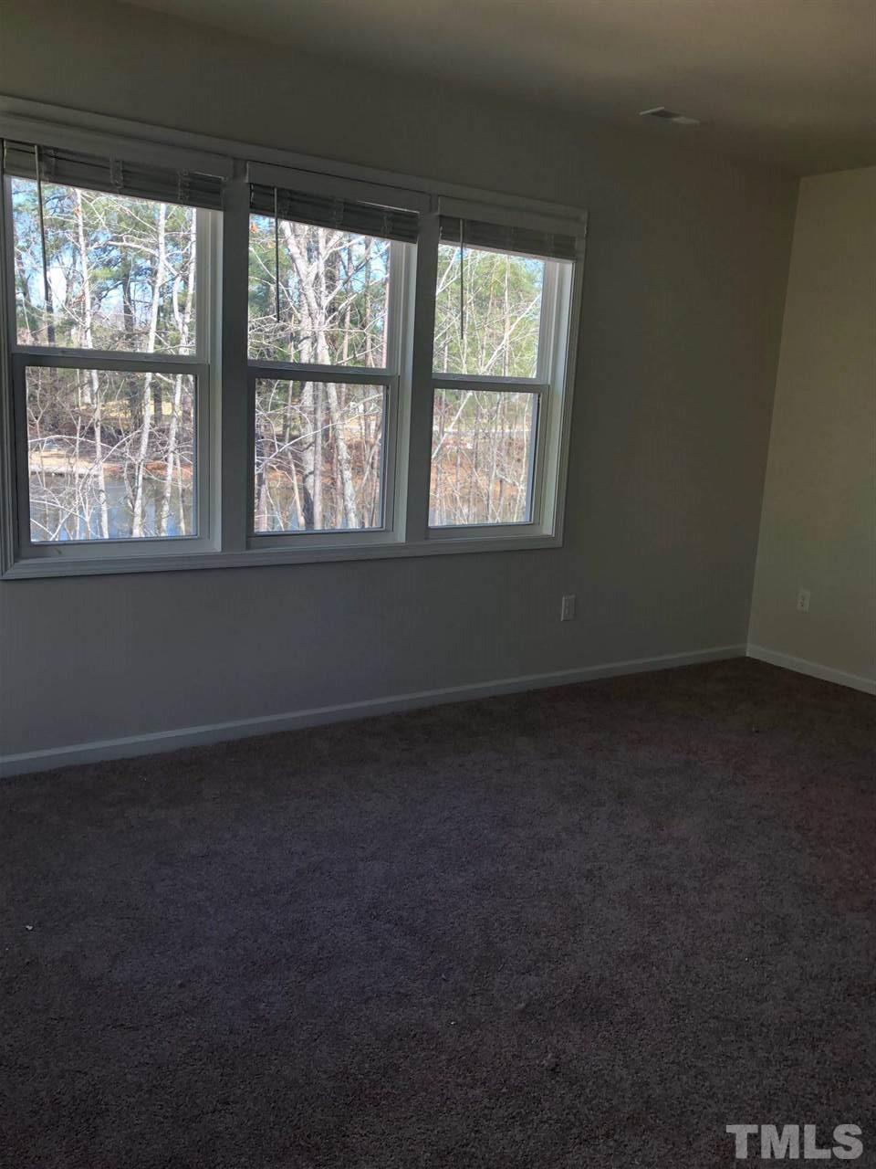 3627 Water Mist Lane, Unit 17 Raleigh, NC 27604 - Photo 12 of 17 an empty room with a window