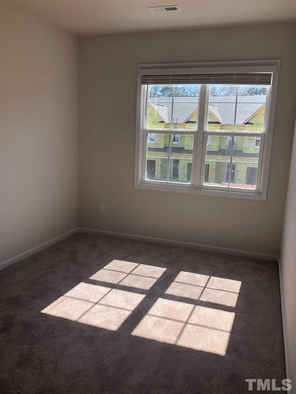 3627 Water Mist Lane, Unit 17 Raleigh, NC 27604 - Photo 15 of 17 an empty room with a window