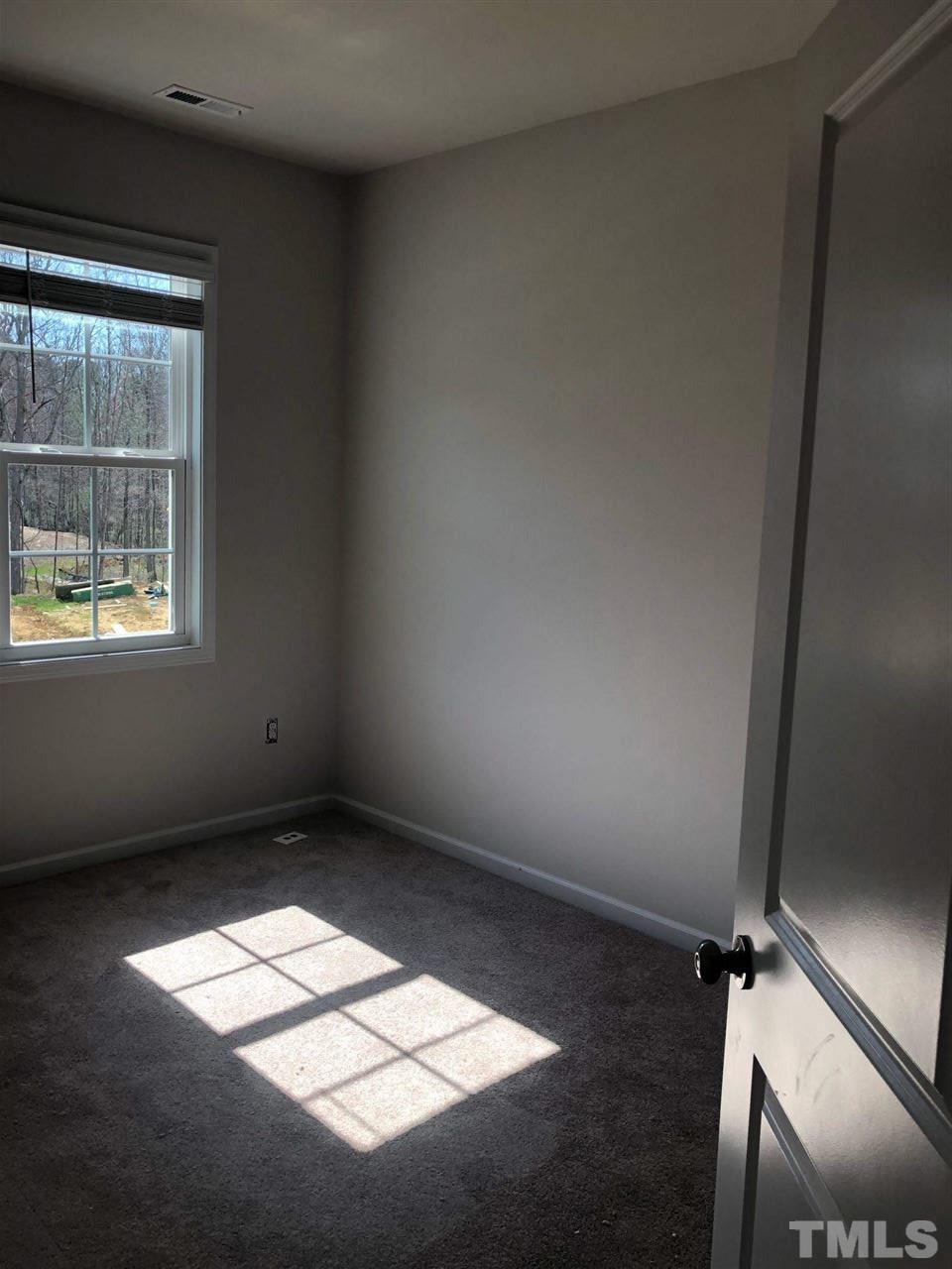 3627 Water Mist Lane, Unit 17 Raleigh, NC 27604 - Photo 16 of 17 an empty room with a window