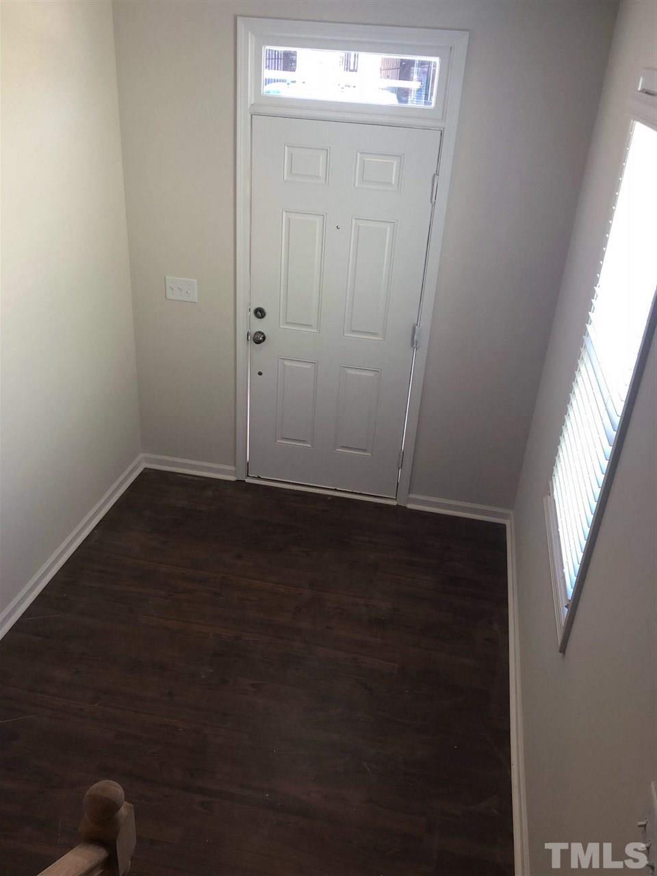 3627 Water Mist Lane, Unit 17 Raleigh, NC 27604 - Photo 17 of 17 an empty room with wooden floor closet and windows
