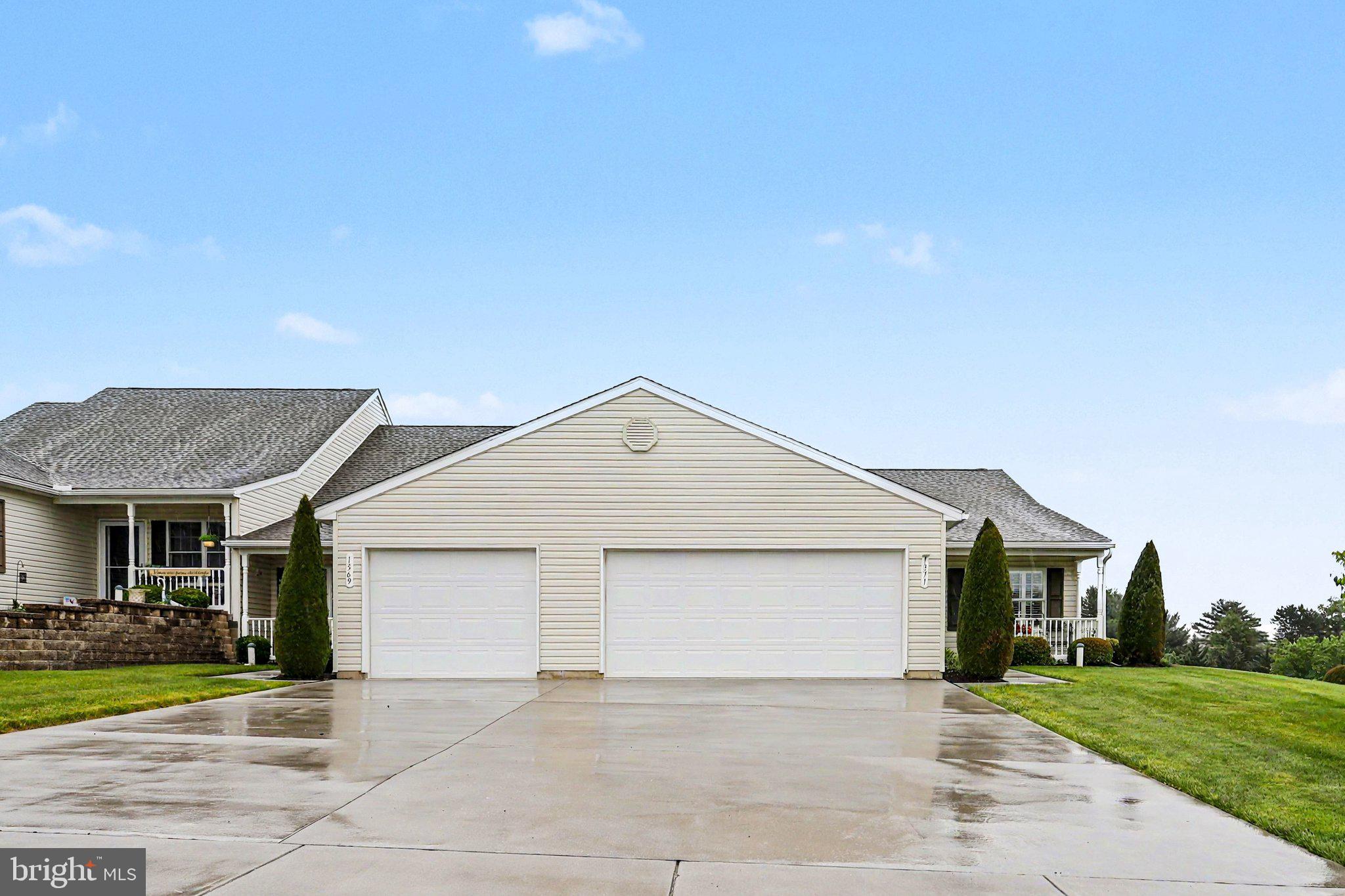 1371 Chami Drive, Unit 166 Spring Grove, PA 17362 - Photo 5 of 28 a front view of a house with a yard and garage