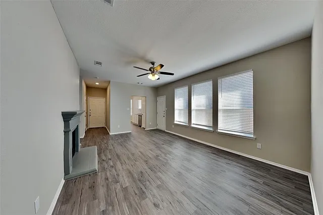 a view of livingroom with hardwood floor and a ceiling fan