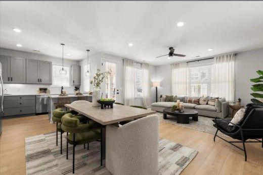 222 Gabriel Boulevard Woodstock, GA 30188 - Photo 4 of 8 a kitchen with a dining table chairs and view living room