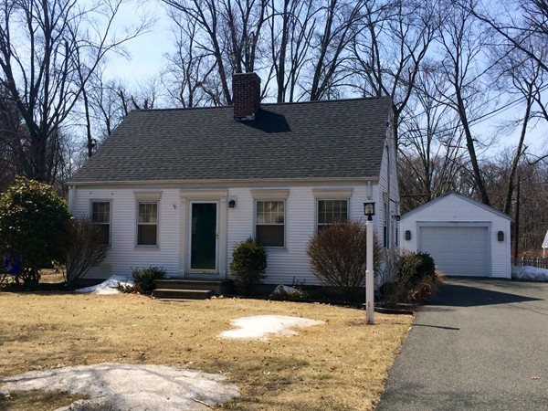 84 Mayflower Road Springfield, MA 01118 - Photo 1 of 14 a front view of a house with a yard and garage