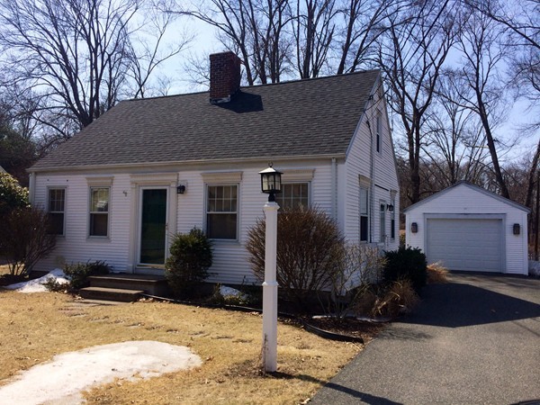 84 Mayflower Road Springfield, MA 01118 - Photo 2 of 14 a front view of a house with a yard covered in snow