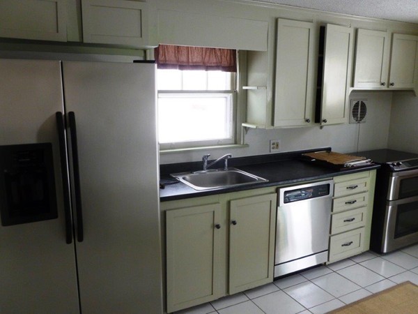 84 Mayflower Road Springfield, MA 01118 - Photo 3 of 14 a kitchen with cabinets appliances and a sink