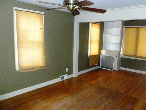 84 Mayflower Road Springfield, MA 01118 - Photo 8 of 14 a view of an empty room with a window and a bathroom